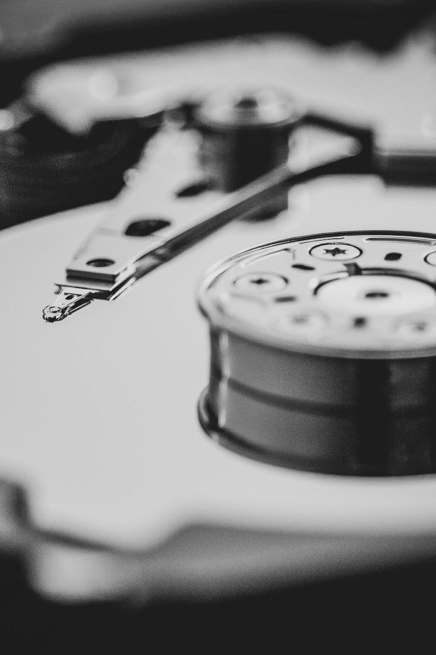 white and black turntable in grayscale photography